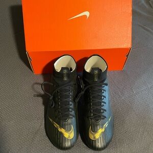 NWT box included. Nike Superfly 6 cleats. Black and gold with Dynamic Fit sock.